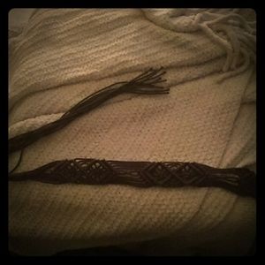 Braided benders of brown sash leather art piece